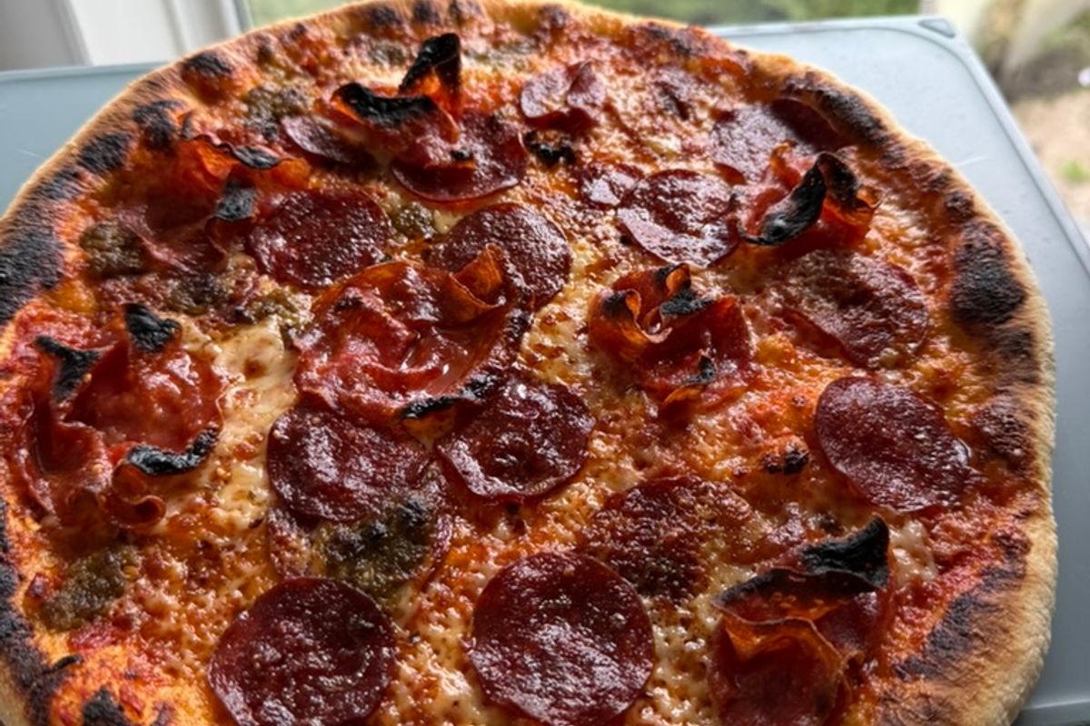 baked pizza with char