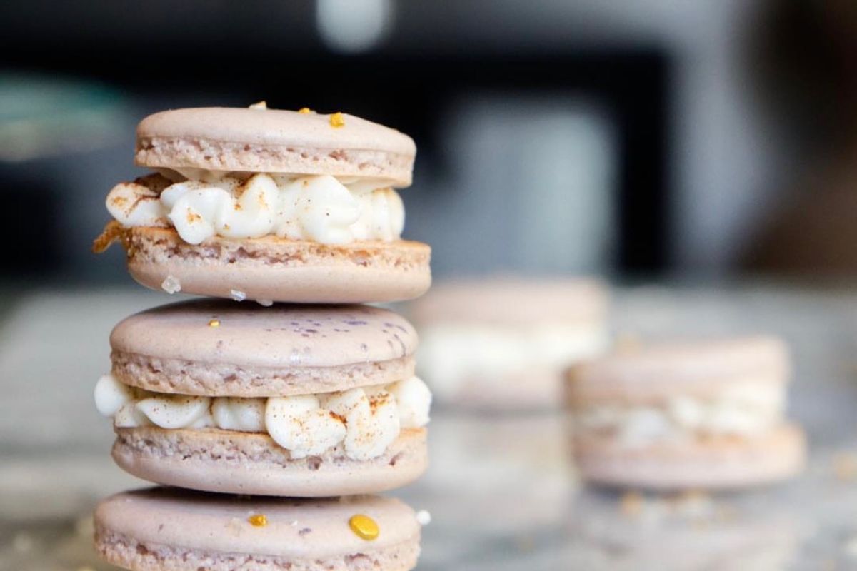 Macarons stacked on marble board