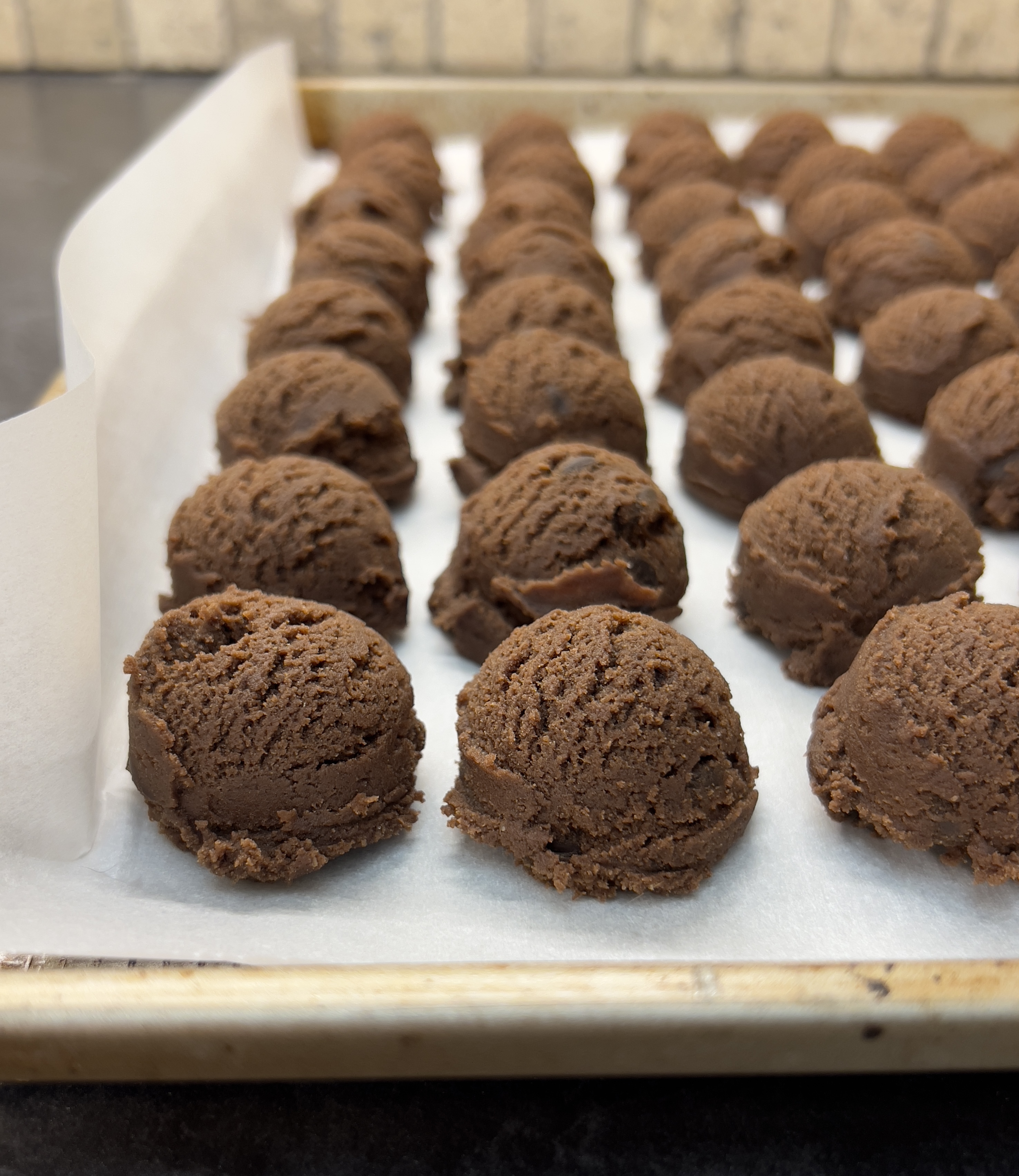 Chocolate cookies before candy cane sprinkle. 
