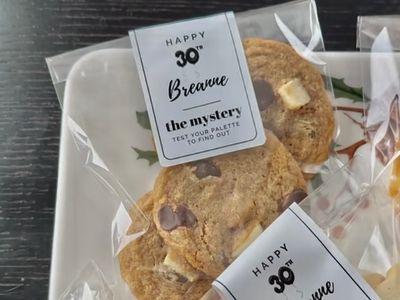 cookies in a bag that are dark chocolate, rosemary, and grana padano