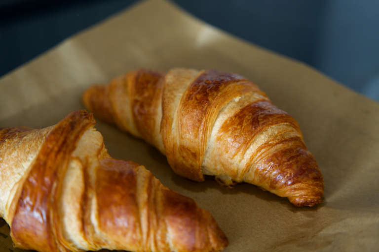 freshly baked croissant on parchment paper 